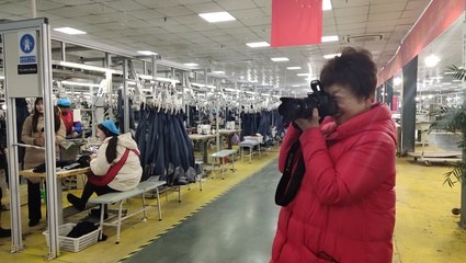 东锦服饰公司迎来界首市大美采风团，共话销售业务新图景